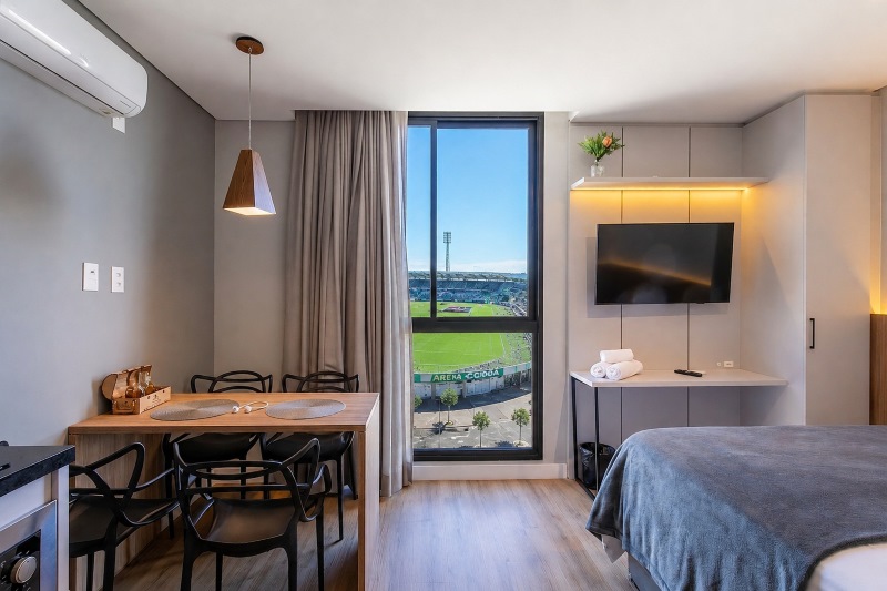 Apartamento premium com vista para estádio de futebol representando oportunidades de negócios na Copa do Mundo e experiências de hospedagem
